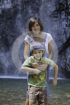 Mother and son were playing water at Chok Kra-DinÂ WaterFalls at Kanchanaburi in Thailand
